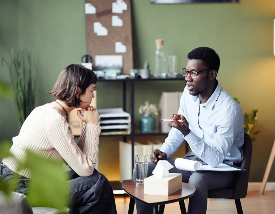 Psychology Degree Graduate Speaking with Client